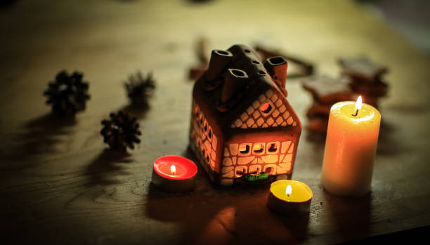 istock gingerbread house candle on blurred background of the table 939117542