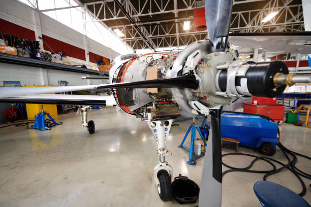 Private jet aircraft in the hangar open for regular maintenance service.