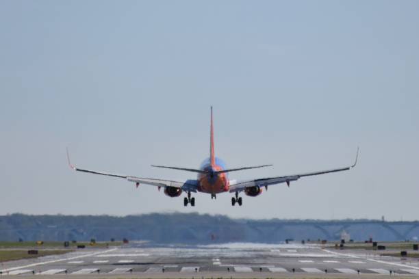 istock Airplane Flying Against Clear Blue Sky 939118242