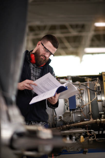 istock Aircraft mechanic in the hangar 939118472