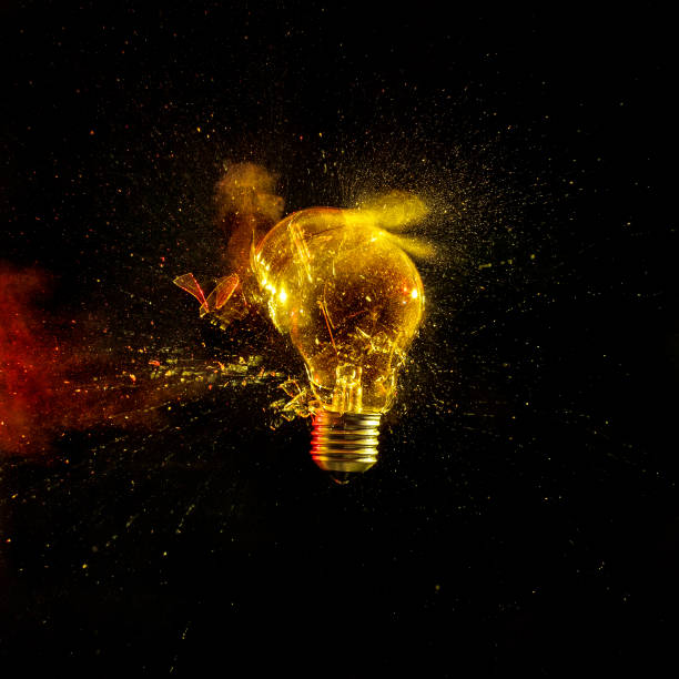 istock Close-Up Of Broken Light Bulb Against Black Background 939118606