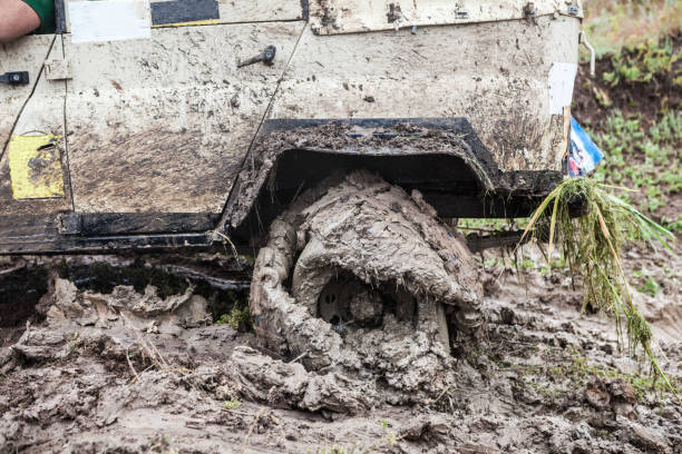 Suv 4wd car rides through muddy road
