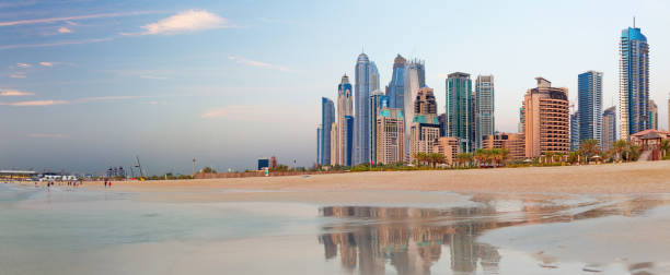 istock Dubai - The Marina towers from beach in evening light. 939125036