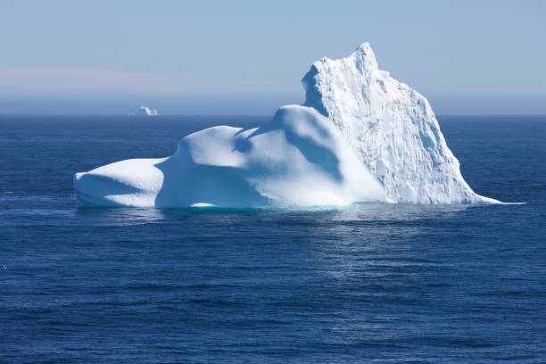 istock Greenland floating iceberg in deep blue ocean water 939125776
