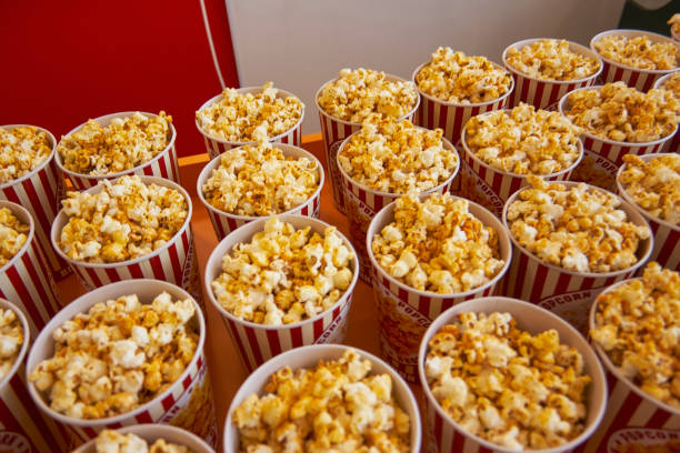 istock Many cups with popcorn on the counter close-up 939128460