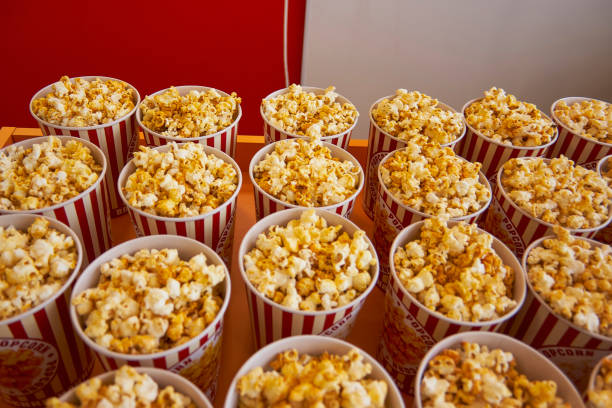 istock Many cups with popcorn on the counter close-up 939128464
