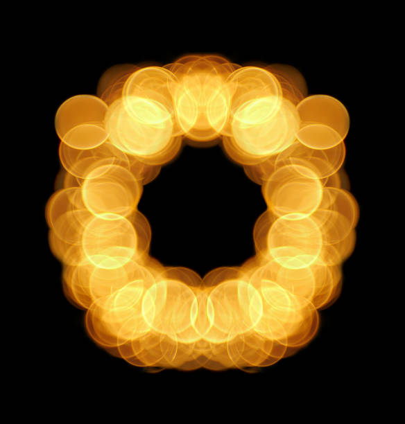 istock Letter and number from lighting circle bokeh on black background. 939128652