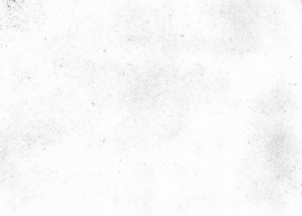 Subtle halftone dots vector texture overlay Subtle halftone vector texture overlay. Monochrome abstract splattered background. paper textures stock illustrations