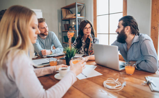 istock Young business people having meeting 939134560