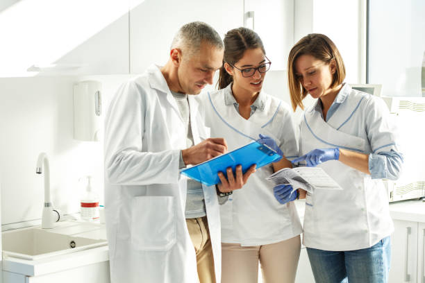 istock Medical dentist team in dental office 939144076