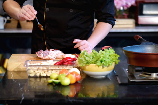 istock Close Up hands chef cooking raw material in the kitchen 939145110