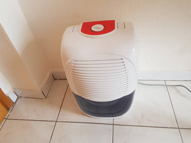 istock dehumidifier  in the room on the floor white red plastic 939145358