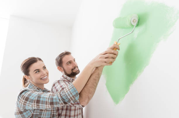 istock Loving couple painting together 939145446
