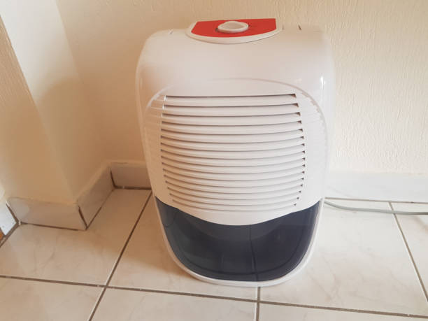 istock dehumidifier  in the room on the floor white red plastic 939145486