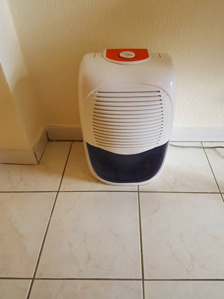 istock dehumidifier  in the room on the floor white red plastic 939145736