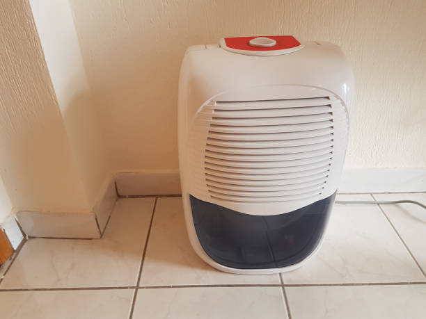 istock dehumidifier  in the room on the floor white red plastic 939148488