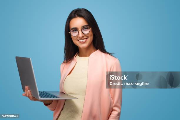 Smart Girl With Laptop On Blue Stock Photo - Download Image Now - Laptop, Women, Colored Background