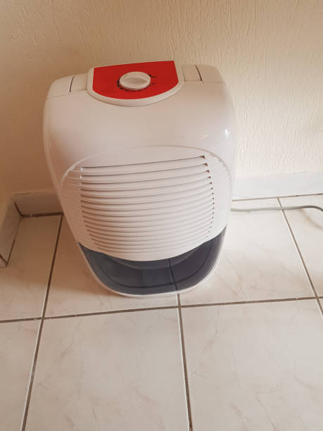 istock dehumidifier  in the room on the floor white red plastic 939148728