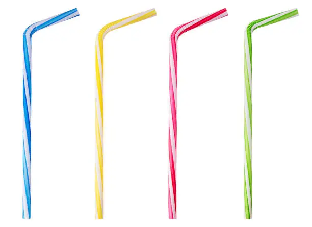 Photo of Four drinking straw pink, blue, yellow, green striped