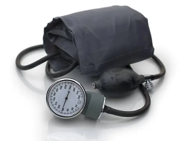 Closeup of a sphygmomanometer isolated over white background