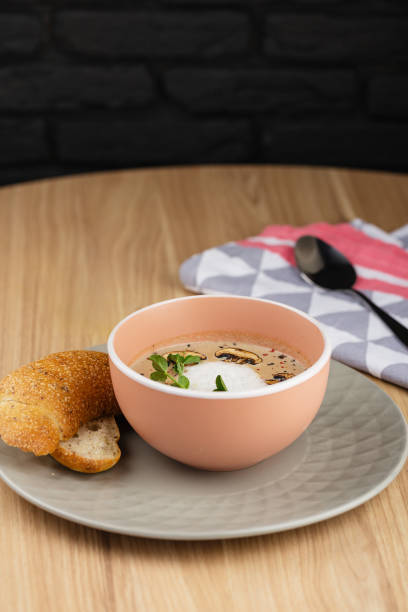 istock Mushroom cream soup and champignon in bowl 939153898