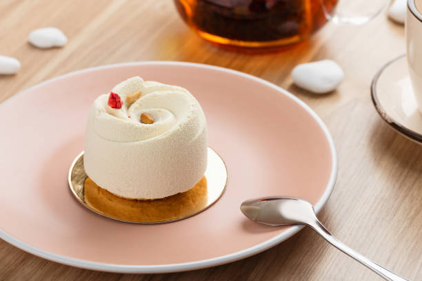 istock Mini mousse pastry dessert covered with white chocolate velour 939154026