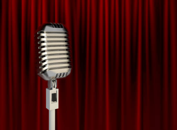istock Stage Microphone in front of Red Stage Theater Curtain. 939155432
