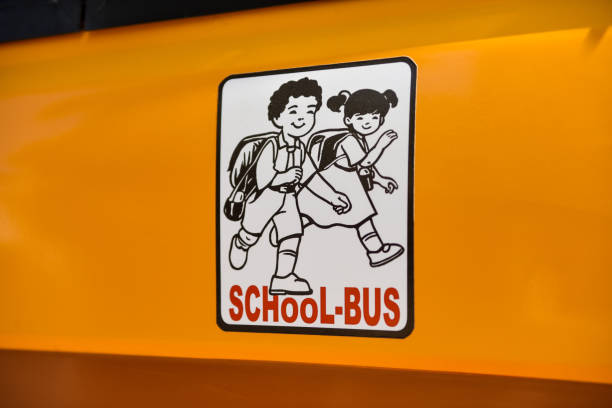 Rear view of orange school bus with flashing lights and stop Sign. White background.-For more bus images, click here.  BUS 