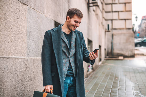 istock Handsome businessman in the city 939167484