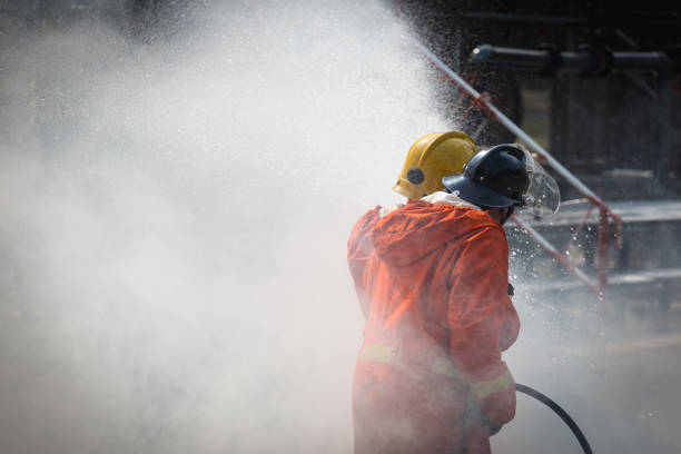 istock Firefighters training, Team practice to fighting with fire in emergency situation.Spray water to the flame 939173334