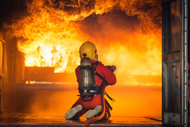 istock Firefighters training, Team practice to fighting with fire in emergency situation.
Spray twist water to the flame 939173368