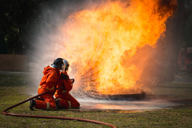 istock Firefighters training, Team practice to fighting with fire in emergency situation.
Spray water to the flame 939173376