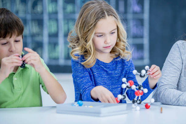 istock Girl learns chemistry 939174420