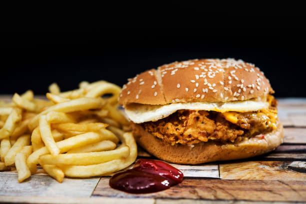 istock Cheese burger - American cheese chicken burger with fresh salad 939178616