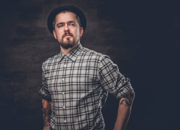 istock Bearded man with tattooed arms. 939184174