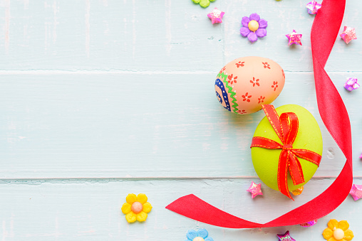 Easter egg hunt concept. Beautiful Happy Easter text greeting card. Eggs painted in pastel colors. White illustration background with copy space and clipping path. Modern minimal design for social media, sale, advertisement, web.