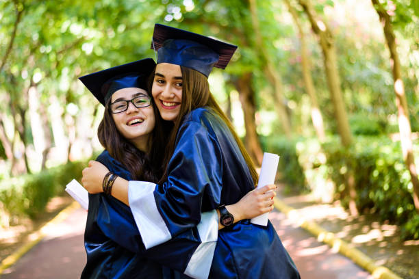 istock Two graduated student girls 939185860
