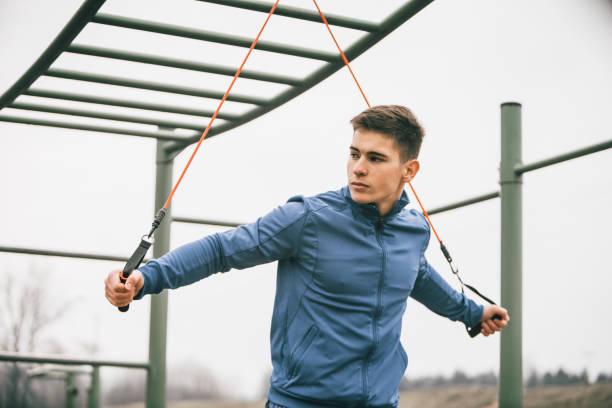 istock Young athlete exercising with resistance band 939185942