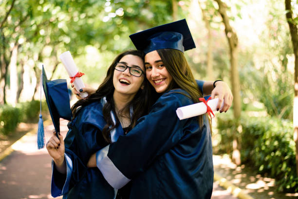 istock Two graduated student girls 939188282