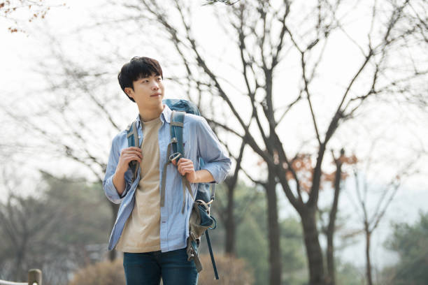 istock young man doing a backpacking trip in a Korean traditional house. 939193872