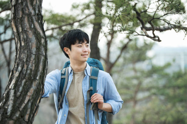 istock young man doing a backpacking trip in a Korean traditional house. 939193876