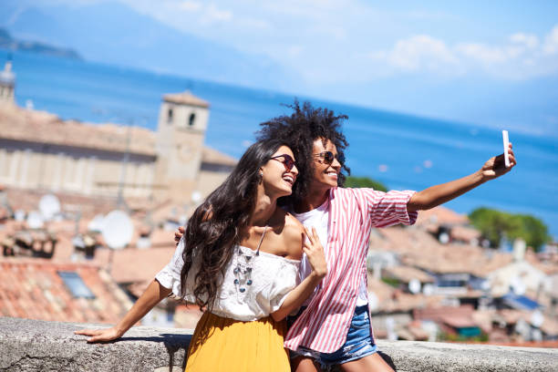 istock Two friends making a self portrait. 939197386