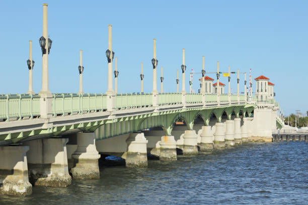 Bridge of Lions - St. Augustine - Florida The Bridge of Lions (c. 1927) in St. Augustine, Florida - known as "The Most Beautiful Bridge in Dixie” - is a drawbridge spanning the Matanzas River between downtown St. Augustine and Anastasia Island. Listed on the National Register of Historic Places, It has been a symbol of the nation's oldest city. bridge of lions stock pictures, royalty-free photos & images