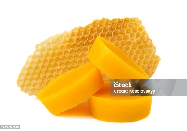Yellow Natural Bee Wax With A Piece Of Honey Cell On A White