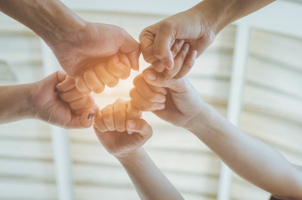 istock teamwork concept of diversity multiethnic people with group hands bump for relationship and together. 939201998