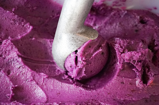 Blueberry Sherbet ice cream flavor in ice cream tank, closed up