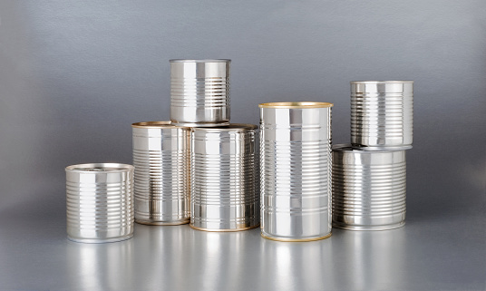 pile of silver cans on silver background