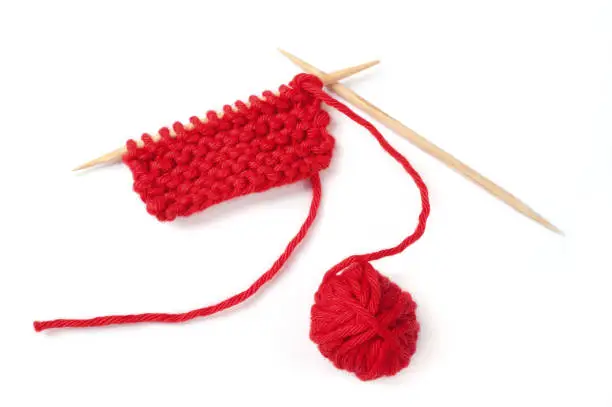 red knitting isolated over white background
