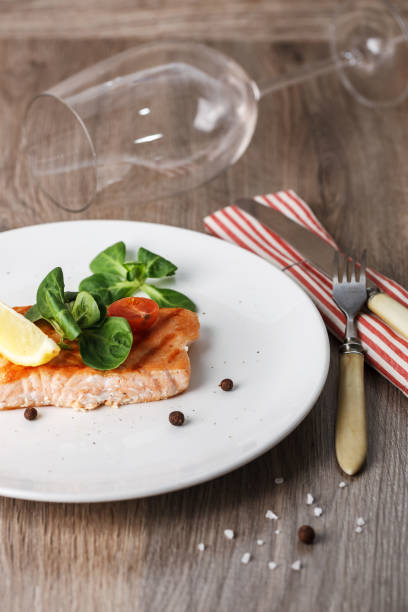 istock grilled salmon with cherry tomatoes and salad 939211864
