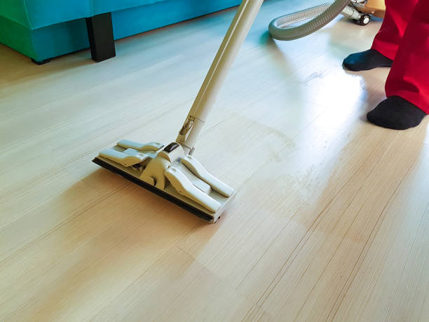 istock men vacuum the floor with steam 939218462